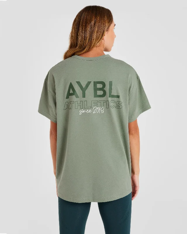AYBL Athletics Oversized T Shirt - Green Front Pockets Side Pockets Patch Pockets